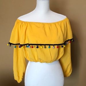 ASOS yellow crop top with pom pom tassels
